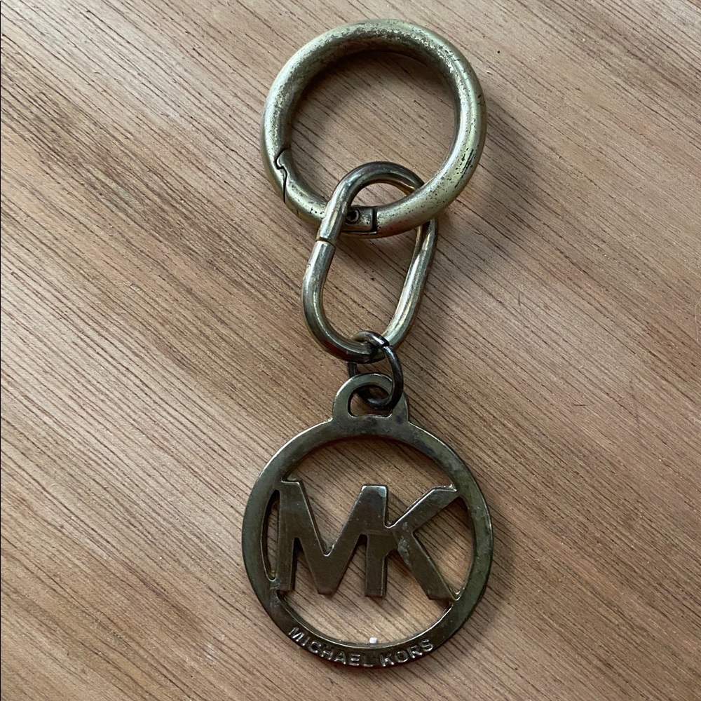 Michael Kors bag charm in good condition